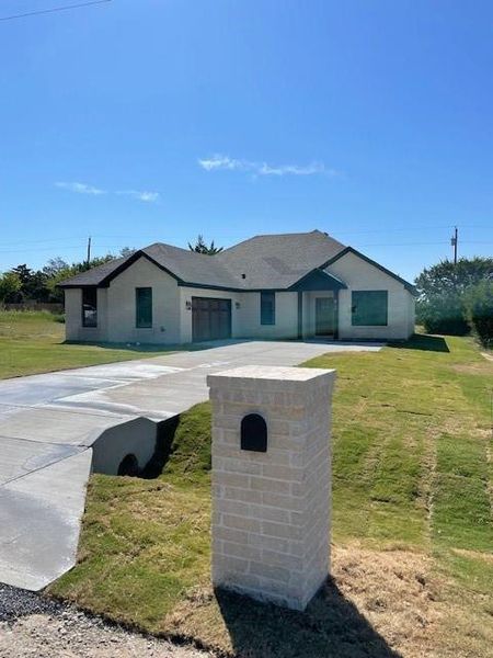 View of front of home featuring a front yard