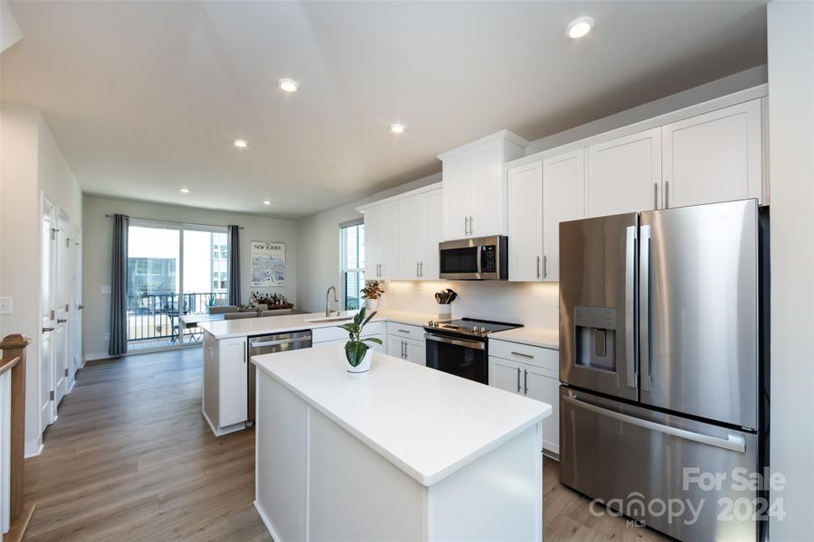 The kitchen opens up to the dining area