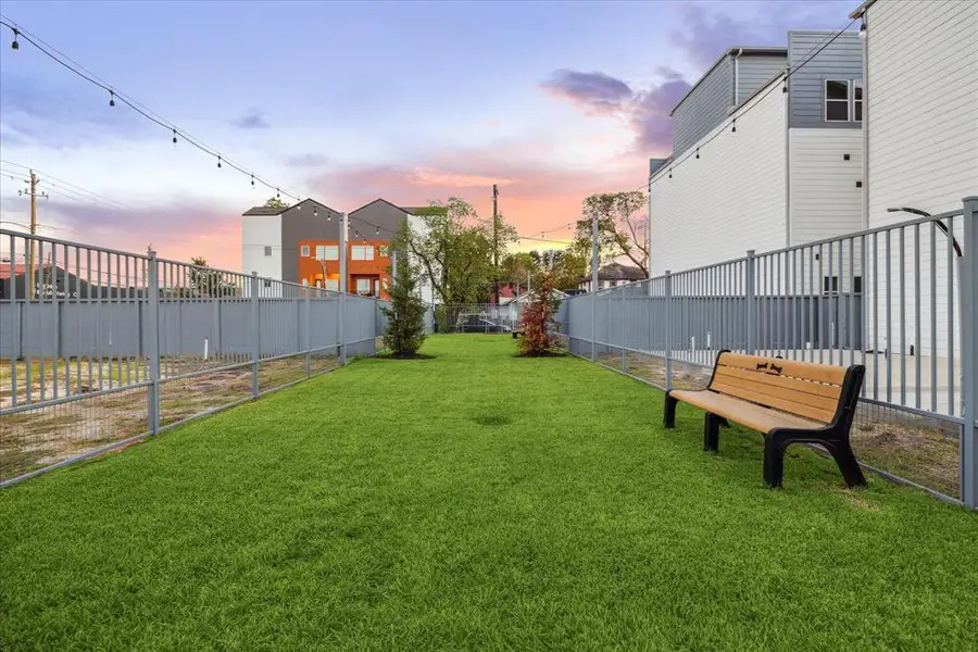 This charming, fenced-in dog park is perfect for your furry friends to enjoy some outdoor fun. Complete with a bench for relaxation, the well-maintained grassy area offers ample space for dogs to play and socialize.