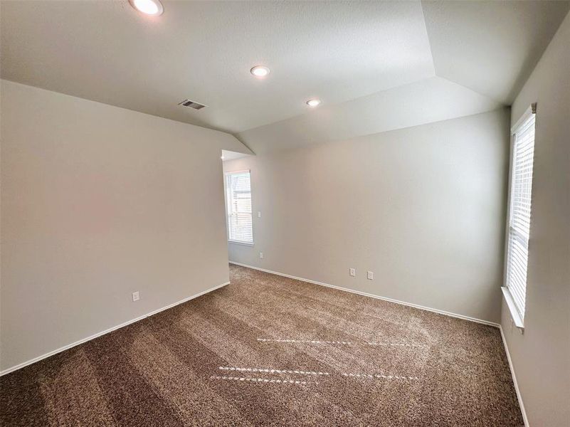 Master bedroom features a vaulted ceiling!