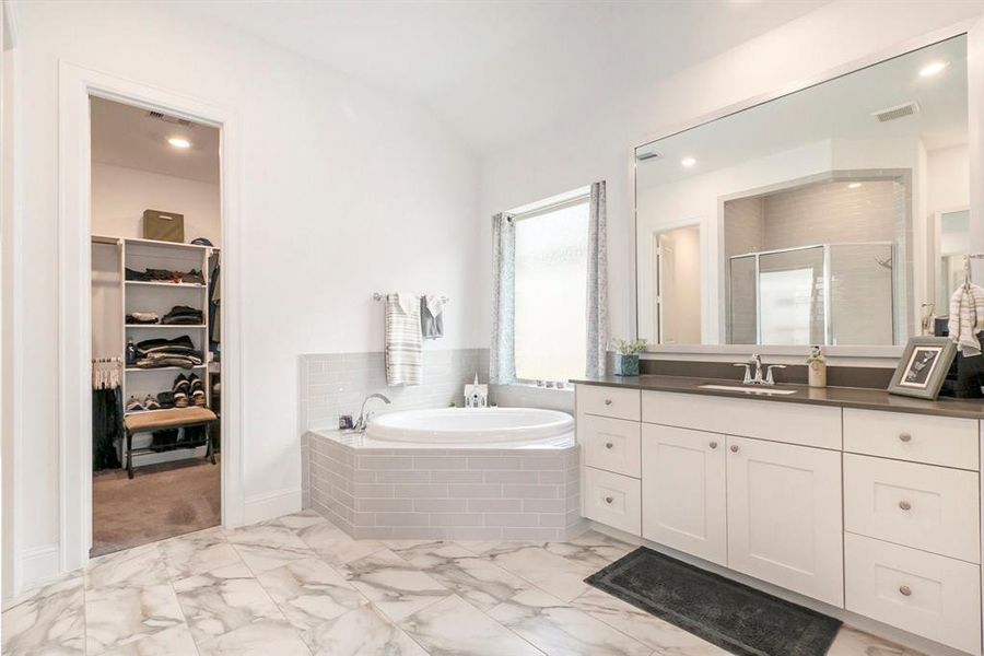 Primary Bath with dual vanities, and large walk-in closet