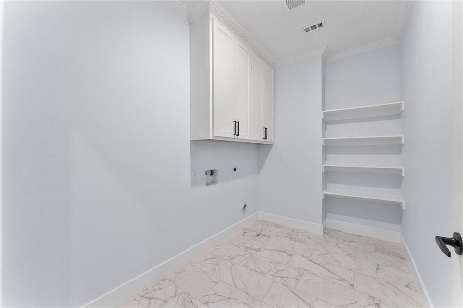 Clothes washing area featuring ornamental molding, washer hookup, cabinets, and hookup for an electric dryer