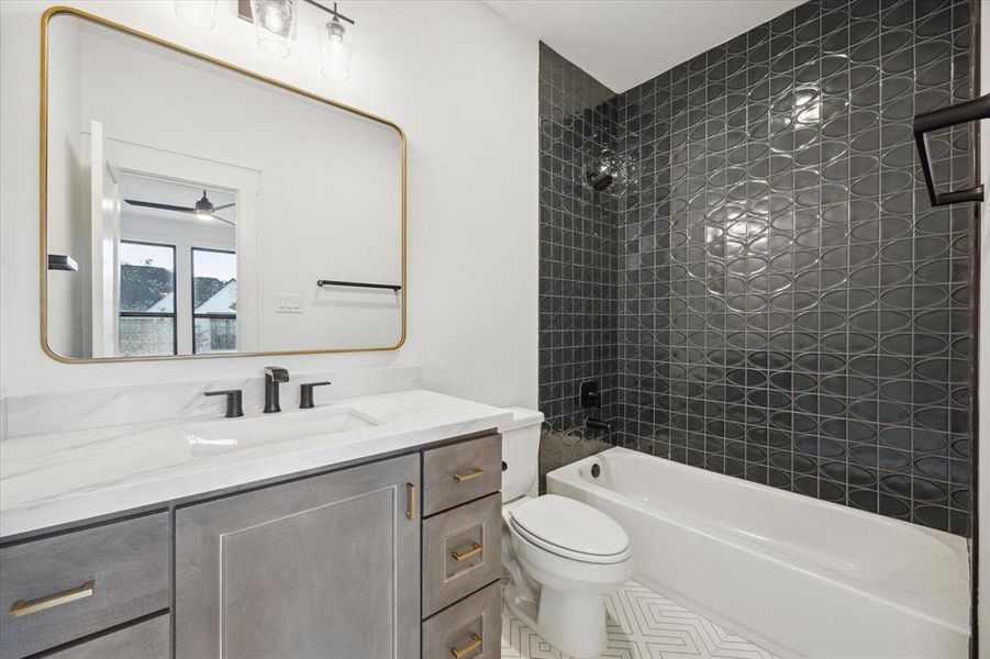 Bath 3-all upstairs bathrooms feature contemporary matte black plumbing fixtures, hand selected designer tile,  elegant quartz countertops, decorative lights and mirrors.