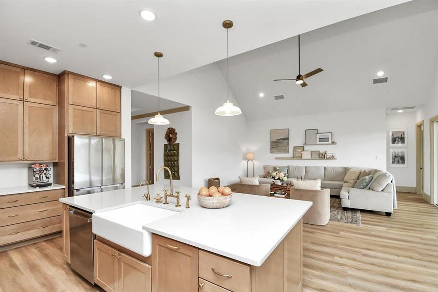 Gorgeous finishes include quartz counters tops, farmhouse sink and brass European faucet and hardware.