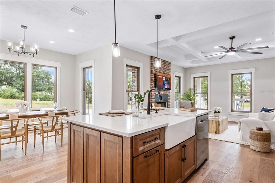 Farmhouse meets functionality with this island and sink and Stainless appliances.