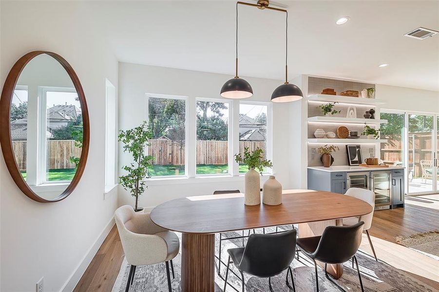 Dining space with light hardwood / wood-style floors