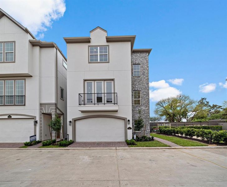 The Claudia plan has a beautiful brick detail and entrance on the side.