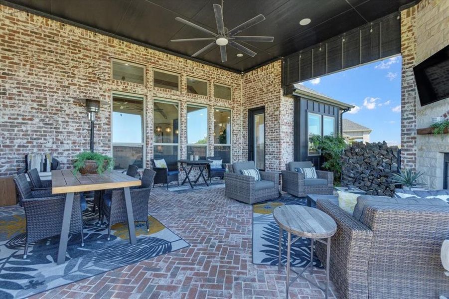 View of patio / terrace with ceiling fan and an outdoor living space