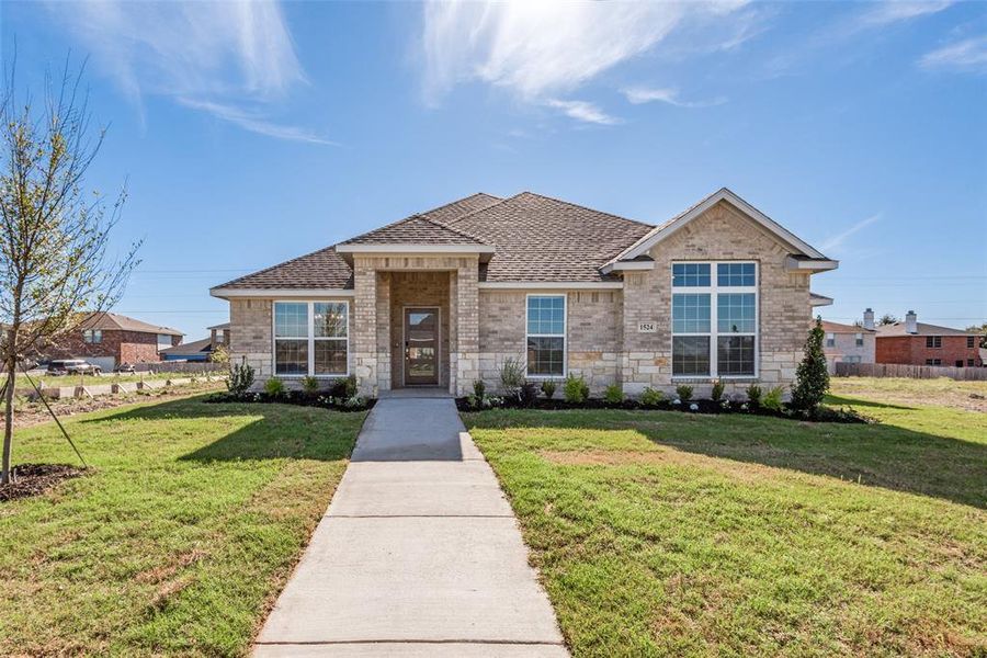 View of front of property with a front yard