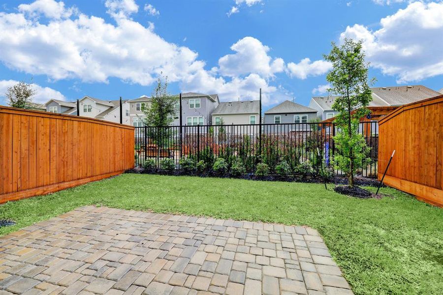 Custom cobble stone patio landscaped to perfection