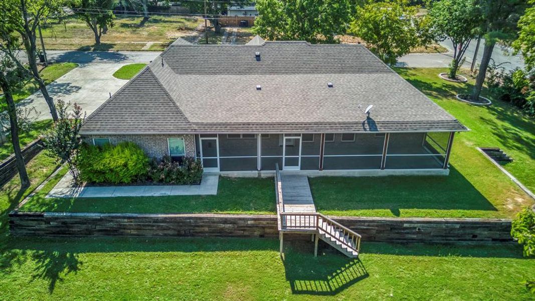 Great shot of the huge screened porch with two exits to outdoors