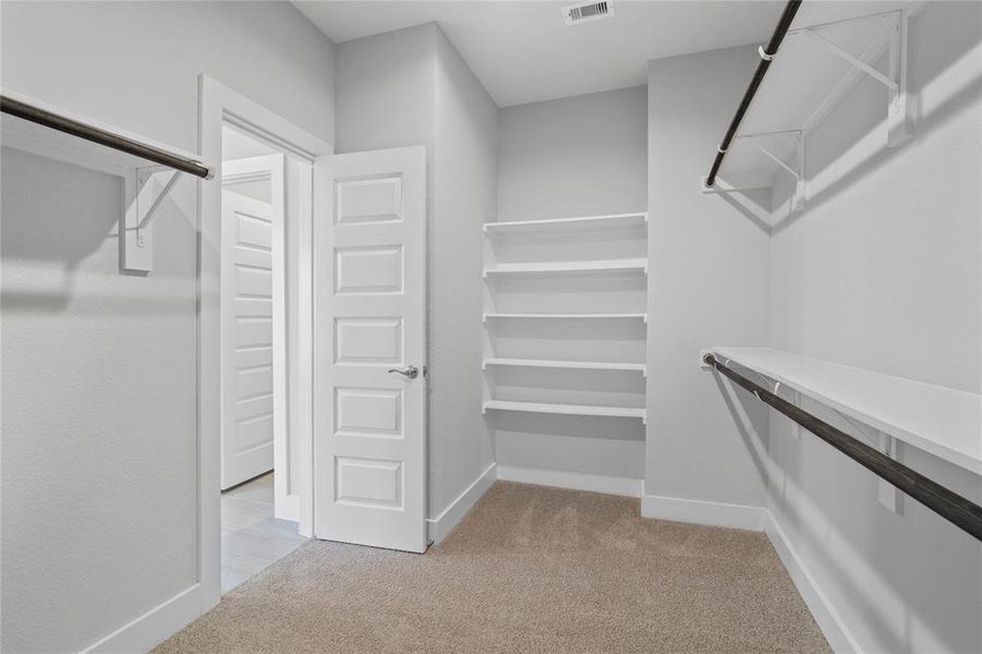 Look at this immaculate closet! With high shelving, multiple rows to hang clothing, you are sure to have enough room for all your belongings!