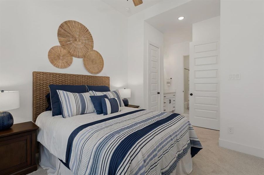 The front guest bedroom offers a walk in closet and a hollywood bath connecting to the workout room.