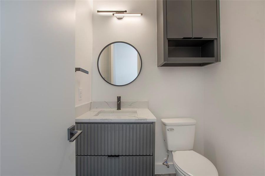 Bathroom featuring toilet and vanity
