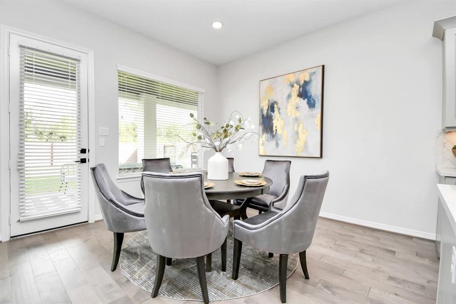 This thoughtfully designed homeseamlessly connects the kitchen witha charming breakfast area.