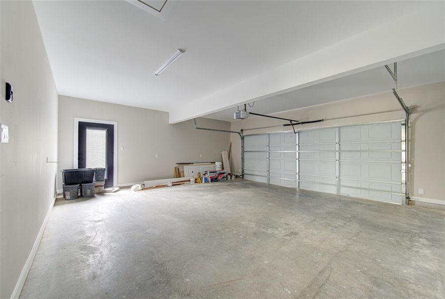 Oversized garage with upgraded outside access door and garage opener