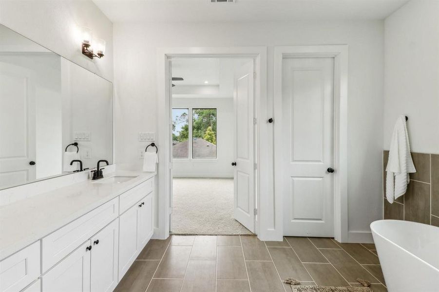 Primary bath area. Photo from a previous project.