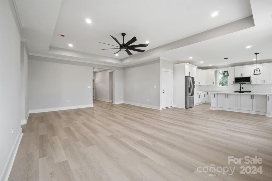 Absolutely gorgeous living room with tray ceilings - 72" ceiling fan