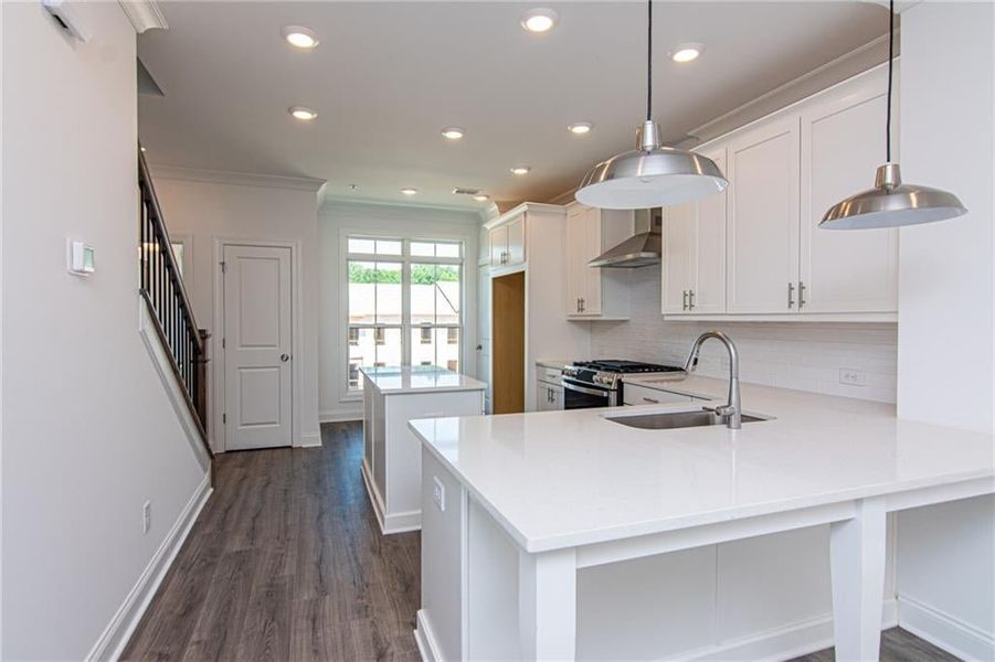 Modern Kitchen with Quartz Countertops and top of the line GE Appliances , not the actual unit previously built .