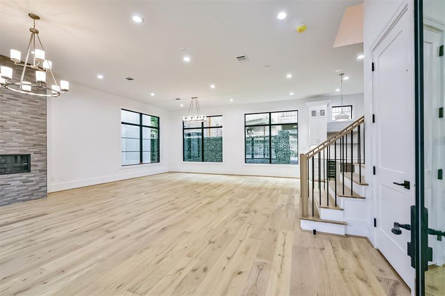 Front Door opens to Family Room featuring an abundance of Natural Light.