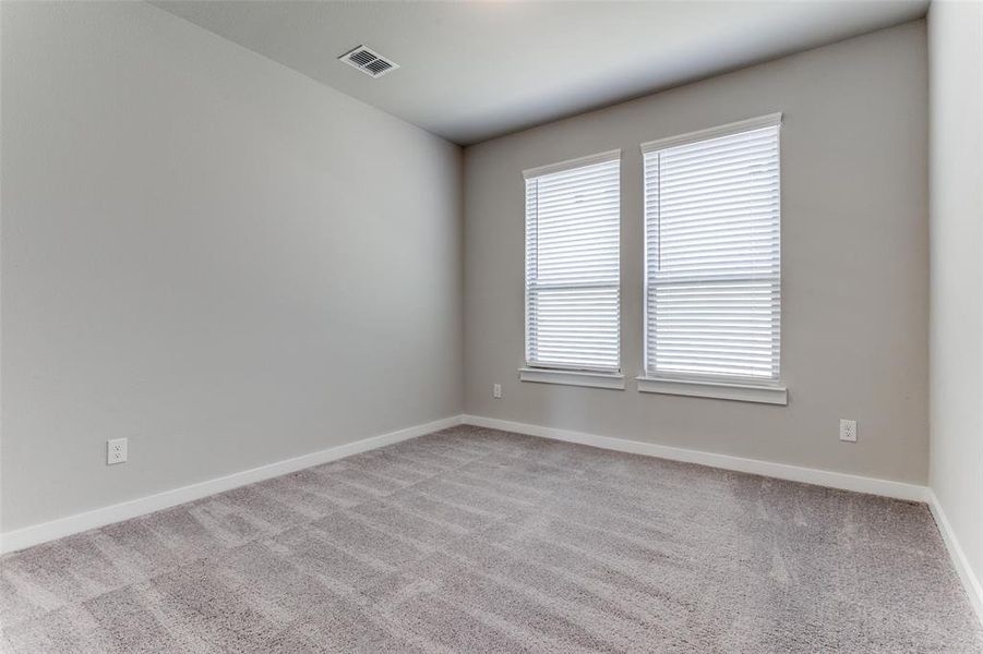 Empty room with carpet floors