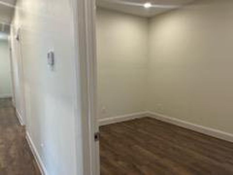 Spare room featuring dark hardwood / wood-style floors