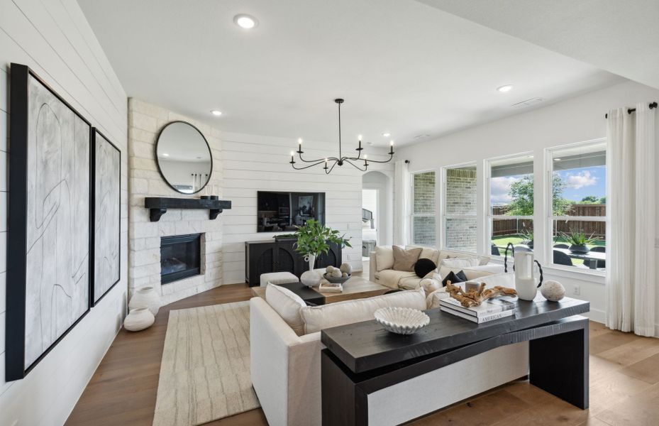 Large windows and optional fireplace in gathering room