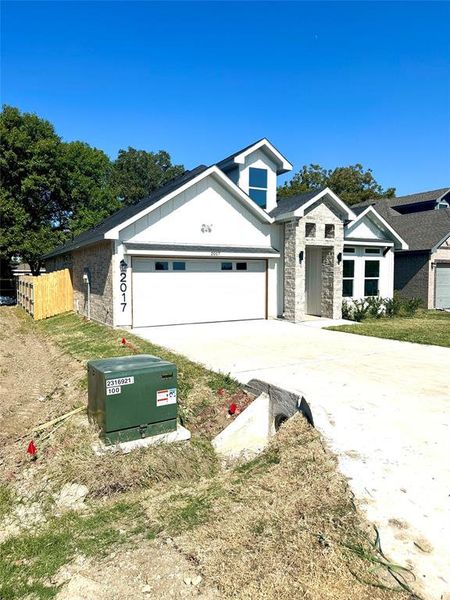 View of front of home with a garage