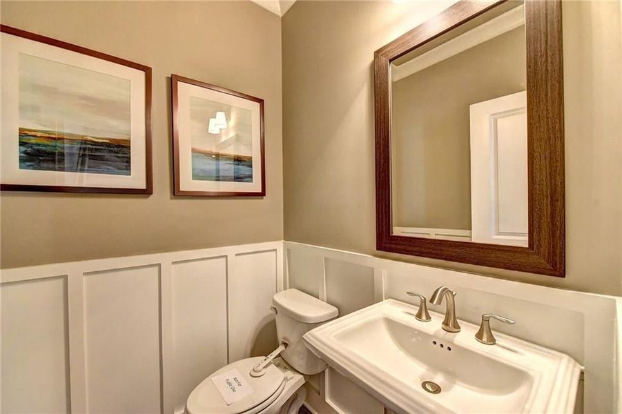 Bathroom featuring sink and toilet ***Photos NOT OF ACTUAL Home but for representation Purposes only. Home is UNDER Construction- Photos are of a previously built Model House Freemont plan by The Providence Group