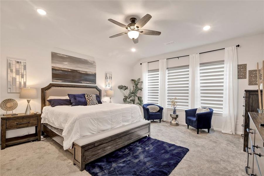 Primary Bedroom Retreat - Large retreat with room for a sitting area, upgraded plush carpet, and custom blinds. A true sanctuary for relaxation.