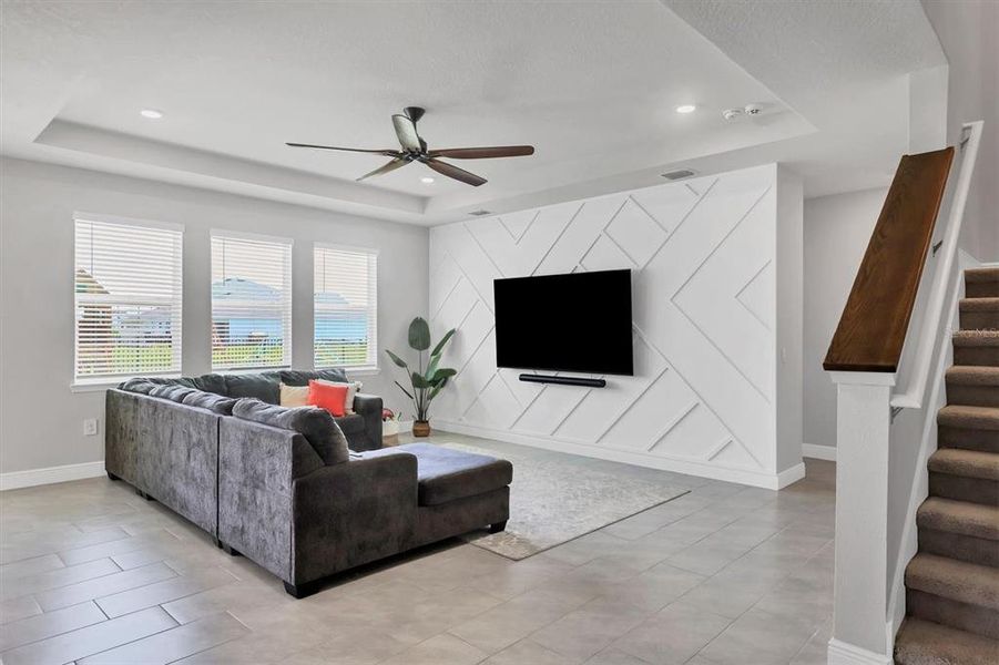 Great room has a 10n foot tray ceiling plus a custom feature wall and wall mount for your TV!