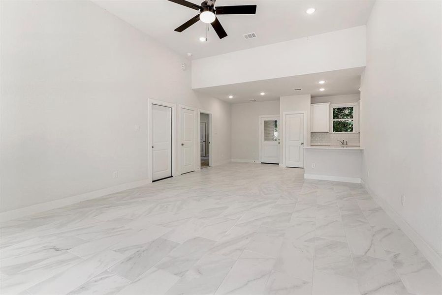 Wow!  12 foot ceilings, modern ceiling fan and beautiful tile floors.