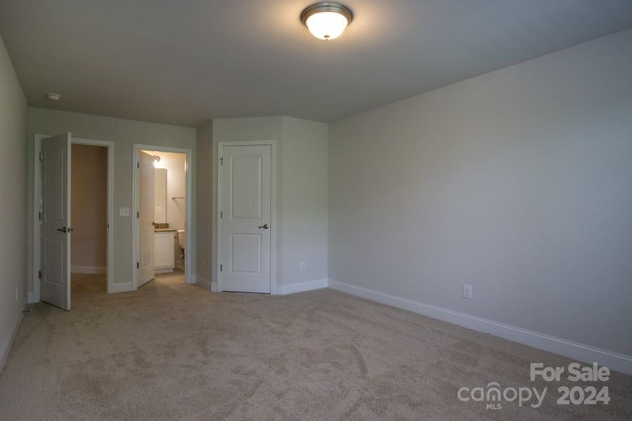 2nd Primary looking to Bathroom and Walk in Closet. Photo representation. Colors and options will differ.