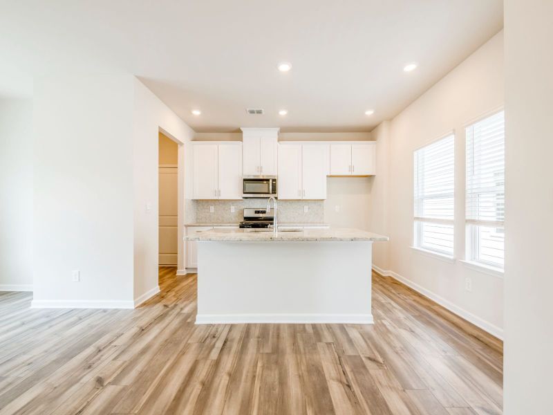 The spacious kitchen island overlooks the dining area and great room.