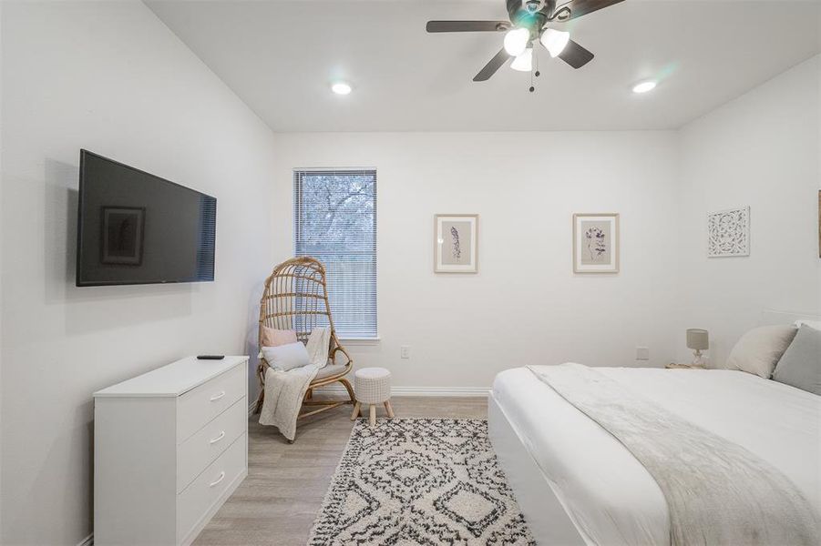 Bedroom featuring ceiling fan and light wood-type flooring