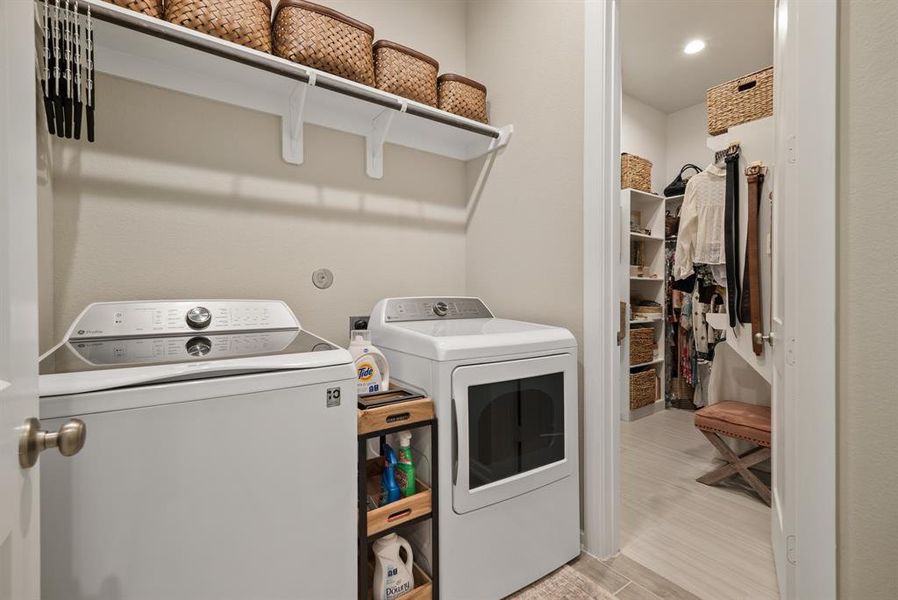 Laundry rooms connects into primary closet! How convenient!