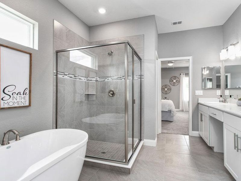 Add an optional freestanding tub to your spa-like en-suite bath, as shown here - Waylyn home plan by Highland Homes