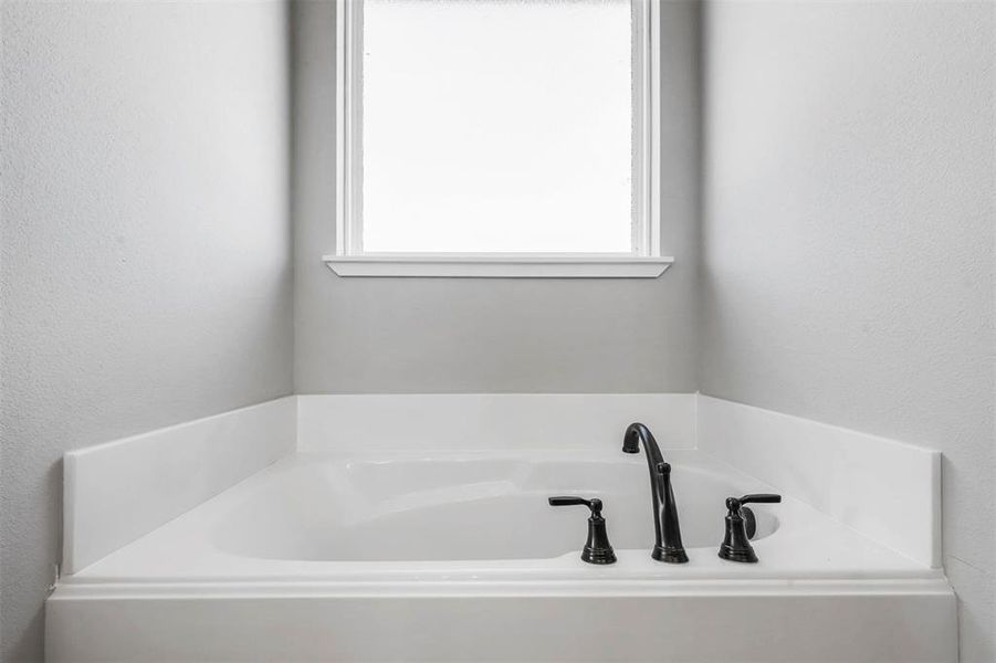 Bathroom with a washtub