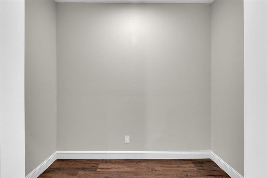 Office area featuring dark hardwood / wood-style flooring