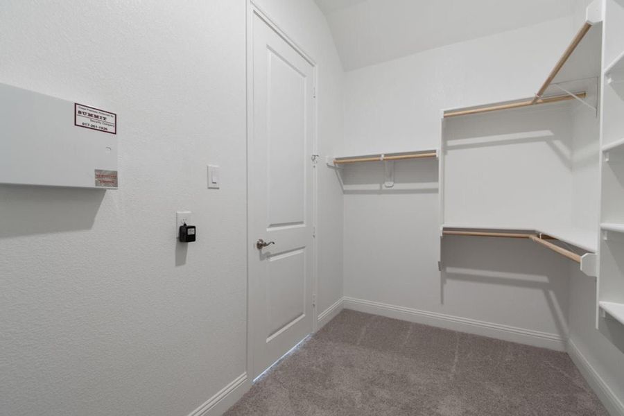 Walk-In Closet | Concept 2406 at Hidden Creek Estates in Van Alstyne, TX by Landsea Homes