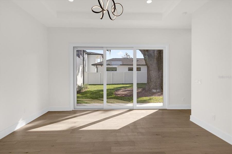 Light pours into primary bedroom from back yard