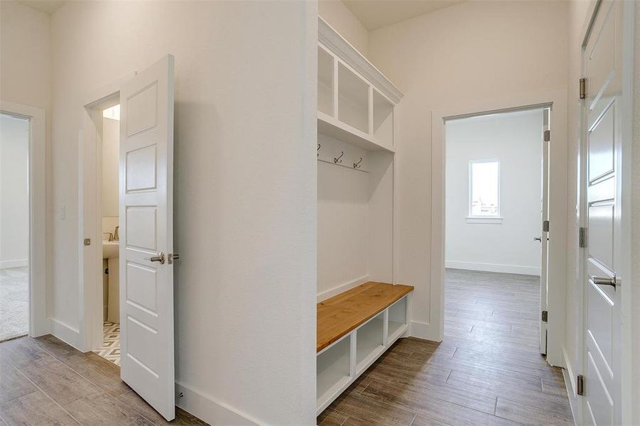 Mudroom featuring wood-type flooring