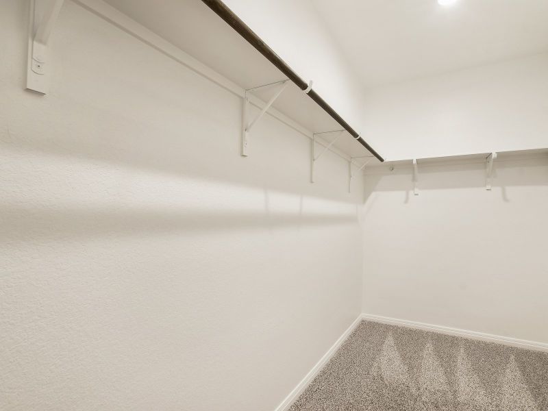 There's plenty of space for storage in the large primary bedroom closet.