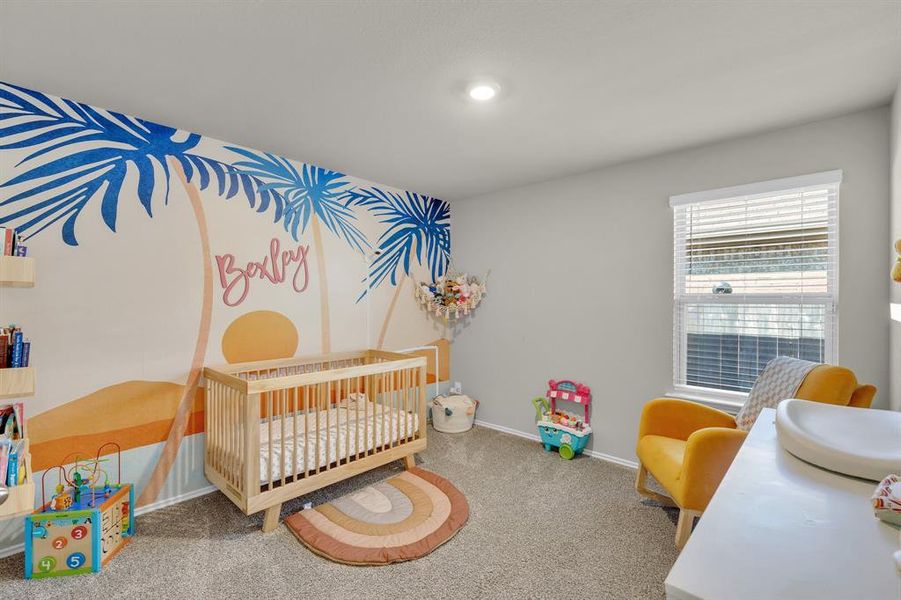 Guest bedroom number 2 features a spacious closet and is currently used as a nursery. Its versatile design allows for easy conversion into a playroom, guest bedroom, or home office, offering flexibility to suit your needs.