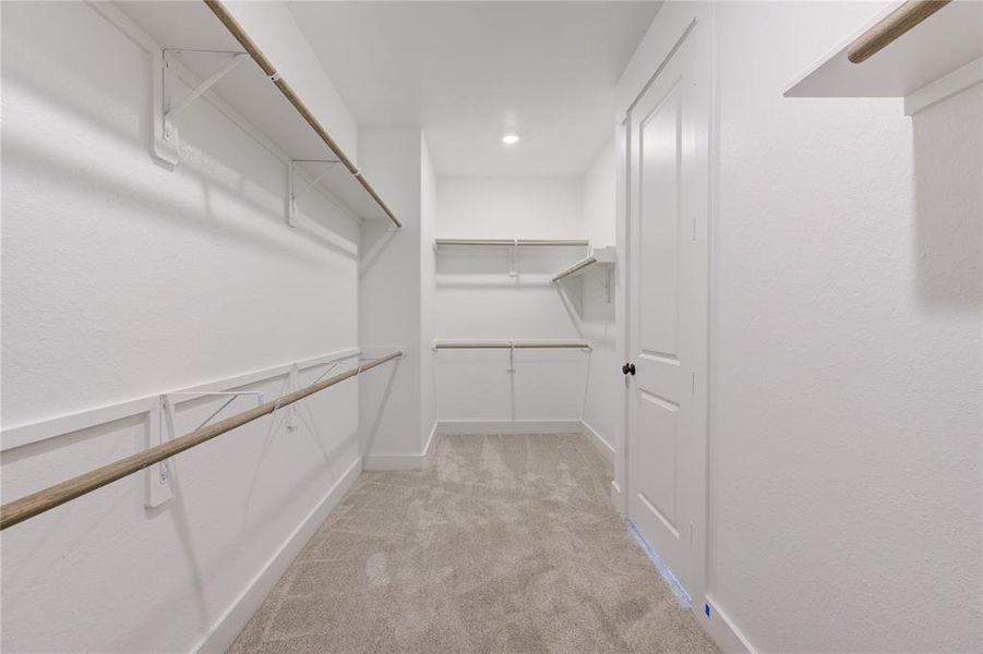 Large walk-in closet located in the Primary Bedroom.