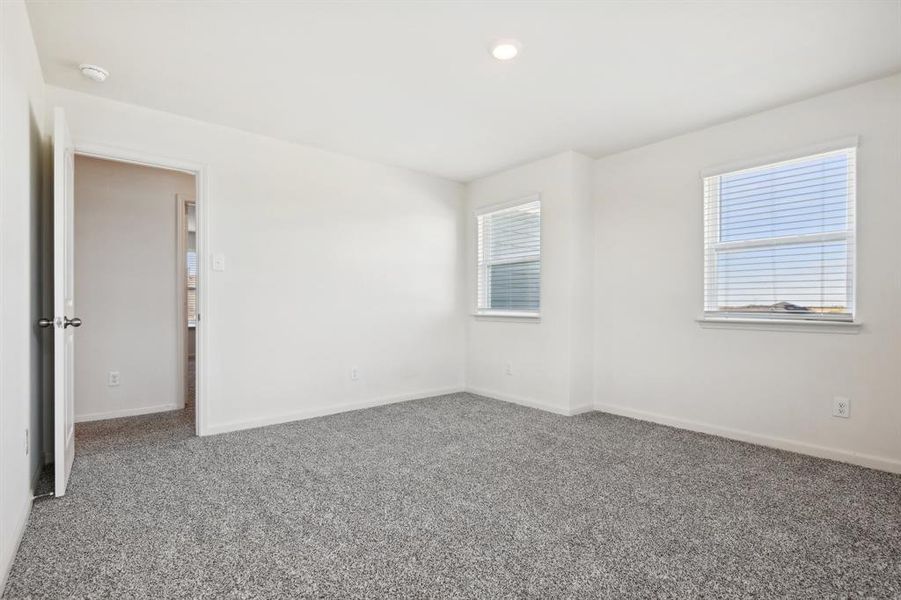 Spare room with carpet and a healthy amount of sunlight