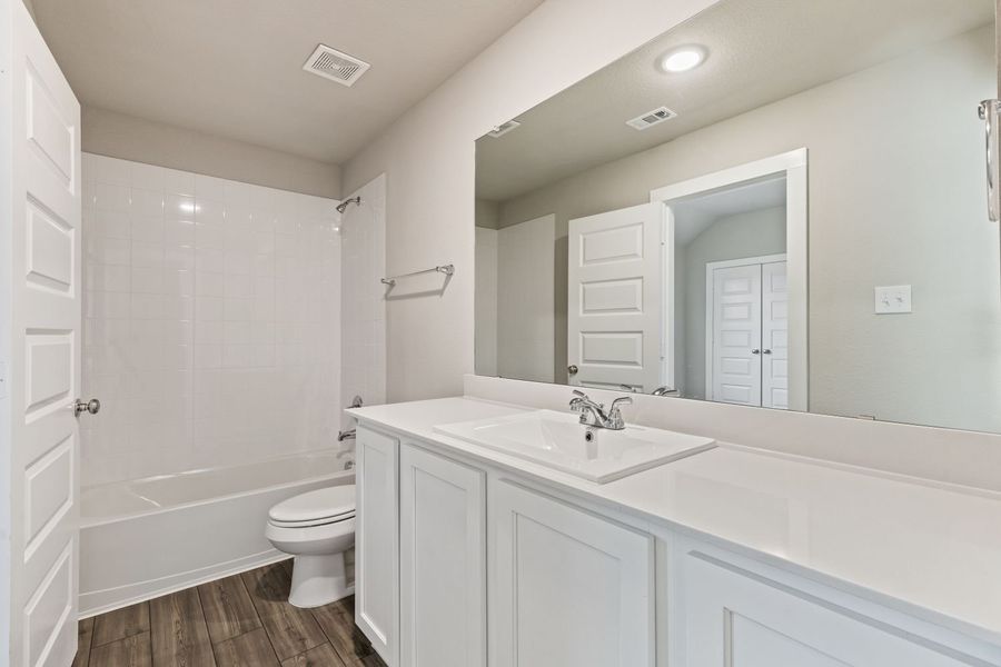 Bathroom in the Willow home plan by Trophy Signature Homes – REPRESENTATIVE PHOTO