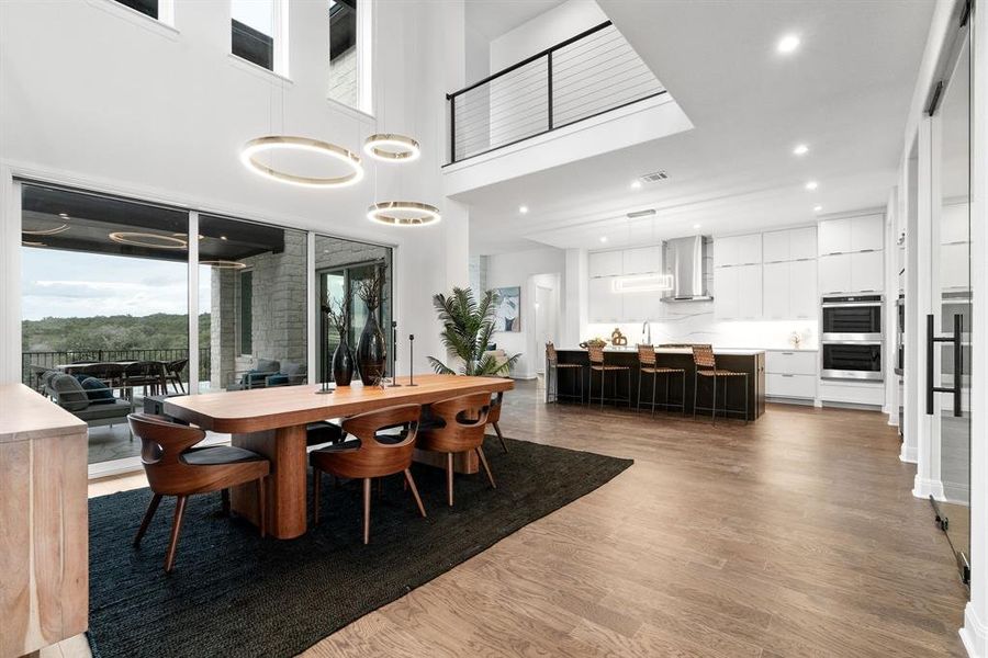 The home features high ceilings, open floor plan and designer lighting