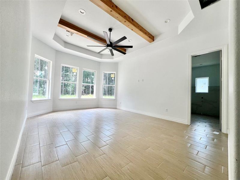 GRAND MASTER BEDROOM WITH CEILING CAN LIGHTS & CEILING FAN.