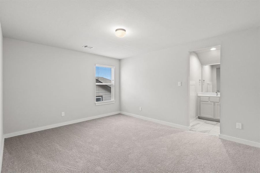 Secondary bedrooms showcase 5-panel doors adorned with modern hardware, large windows enhanced by privacy blinds, and spacious closets featuring sleek and contemporary finishes. Sample photo of completed home with similar floor plan.